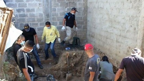 Venezuelan jail search reveals mass grave with 14 bodies