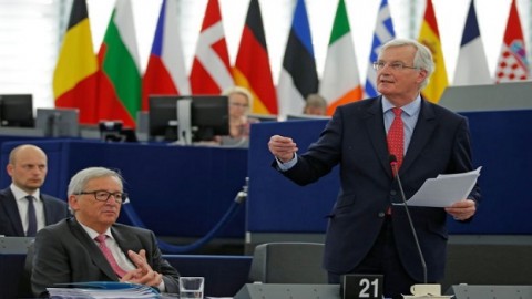 EU lawmakers adopt Brexit resolution, hint at UK return