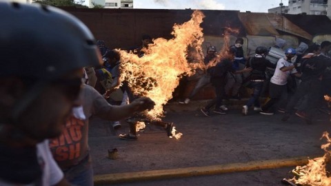Maduro blames woes on Trump ‘conspiracy’ as Venezuela's protest toll rises to 48 dead; man torched