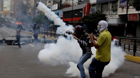 Another violent day in Venezuela raises toll to at least 66 deaths