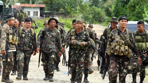 Philippine school siege ends with dozens of hostages freed by fleeing militants