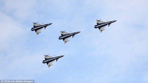 China flies six warplanes close to disputed Japanese islands before telling outraged neighbor to 'stop making a fuss'