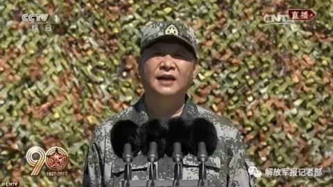 The world's not safe': Chinese President Xi Jinping tells his troops 'a strong army is needed now more than ever' as he shows off new missile launcher in huge military parade