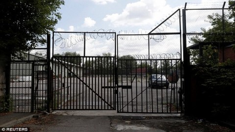 Evicted! US Embassy officials pack up furniture and leave their Moscow suburb compound as Putin kicks out 755 American diplomats in anger over new sanctions