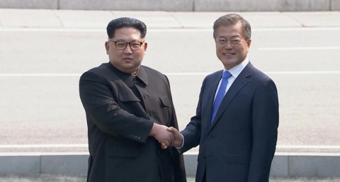 South Korean President Moon Jae-in and North Korean leader Kim Jong Un shake hands as they arrive for talks at the inter-Korean summit at the truce village iof Panmunjom, in this still frame taken from video, South Korea April 27, 2018. (Photo: Reuters screen capture)