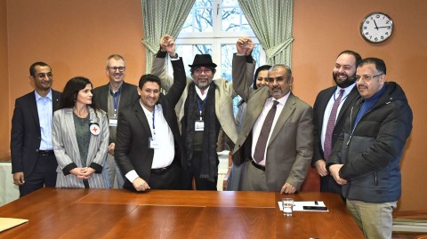 Representatives of the Houthi rebel delegation and the Yemeni government delegation pose for a picture with representatives from the office of the UN Special Envoy for Yemen and the International Committee of the Red Cross Tuesday during peace talks in Rimbo, Sweden. Photo: Claudio Bresciani/AFP/Getty Images
