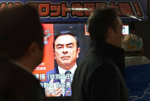 A television screen shows a news program featuring former Nissan chief Carlos Ghosn in Tokyo on Friday. On the same day, Japanese prosecutors re-arrested Ghosn on new charges. Image: AFP-JIJI