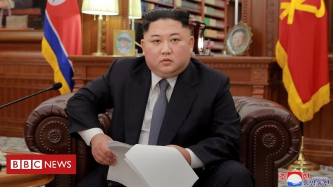 Kim Jong-un was seated on a sofa in a room with portraits of his father and grandfather Photo: Reuters