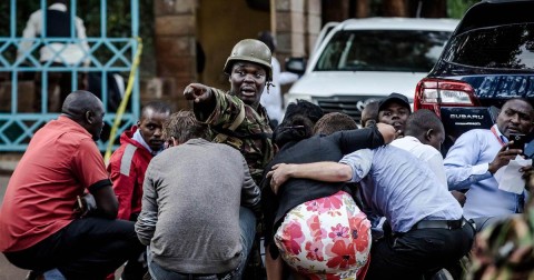 Kenyan personnel help people escape following a bomb blast at DusitD2 Hotel in Nairobi, Kenya, January 15, 2019. Photo: Kabir Dhanji/AFP/Getty Images