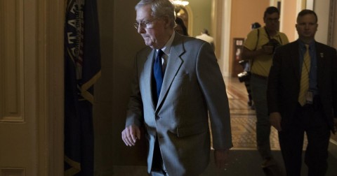 Senate Majority Leader Republican Mitch McConnell (C) walks to his office after leaving the Senate floor following votes on a package of nominations on Capitol Hill, 03 August 2017. Photo: Michael Reynolds