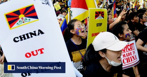 Tibetans living in exile in India take part in a protest against China on Sunday, on the annual Tibetan Uprising Day commemorating the 1959 uprising against Chinese rule. 