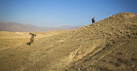 US soldiers climb a hill in Afghanistan. Photo: Lucas Jackson / Reuters