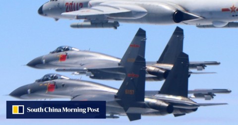 Two PLA Air Force J-11 fighters and a H-6K bomber patrol airspace between mainland China and Taiwan. 
