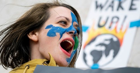 An Austrian youth shouts slogans during a climate protest, part of the 
