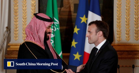 French President Emmanuel Macron and Saudi Arabia's Crown Prince Mohammed bin Salman shake hands.