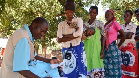 masina-A-healthworker-recording-information-from-patients-health-passaport-in-Balaka-district-in-southern-Malawi.--But-cornonavirus-pandemic-is-forcing-some-people-in--to-shun-th