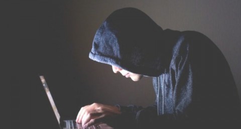 Hacker using laptop (Shutterstock.com)