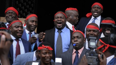 Ugandan Members of Parliament opposed to the extension of presidential age limits wear red bandannas, which they said signified their willingness to die in defense of the constitution, at the Parliament building in Kampala, Uganda, Sept. 21, 2017. Photo: AP