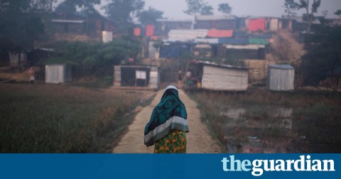 A Rohingya woman walks through a refugee camp. The UN’s resolution passed with a vote 122 to 10. Photograph: Ed Jones/AFP/Getty Images