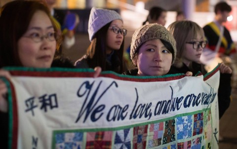 Women protest outside the site of the summit on North Korea in Vancouver on January 15, 2018. (Darryl Dyck/The Canadian Press via AP)