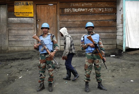 Two UN soldiers stand guard in Goma, DRC after rebels attacked a UN peacekeeping base in eastern Congo, killing at least 14 peacekeepers and wounding 40 others Friday, Dec. 8, 2017. (AP File Photo/Jerome Delay)