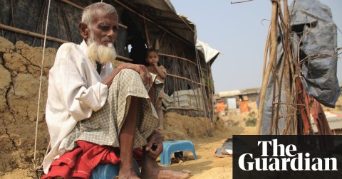 Nagumia, an 82-year-old Rohingya refugee, and his grandchild in the Moinerghona camp. Photo: Ben Doherty for the Guardian