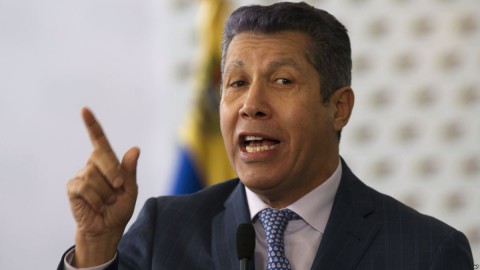 Henri Falcon, a former governor and former aide to the late President Hugo Chavez, speaks to the press after signing a document that states electoral guarantees for the upcoming presidential election at the National Electoral Council in Caracas, Venezuela. Photo: AP