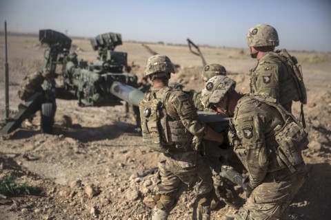 This June 10, 2017 photo provided by Operation Resolute Support, U.S. Soldiers with Task Force Iron maneuver an M-777 howitzer, so it can be towed into position at Bost Airfield, Afghanistan. US Marine Corps photo by Sgt. Justin T. Updegraff via AP