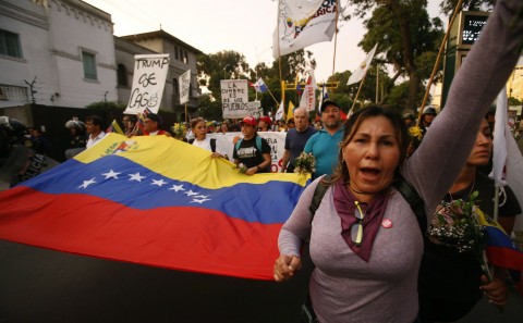 Venezuelans shout anti-Trump slogans during a protest against the Summit of the Americas, in Lima, Peru, Thursday, April 12, 2018. Photo: Karel Navarro/AP
