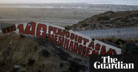 A painting by foreign and local journalists denouncing the murders of journalists in Mexico on the US-Mexico border fence on 14 May. The sign reads: ‘140 journalists murdered in MX.’ Photo: Guillermo Arias/AFP/Getty Images