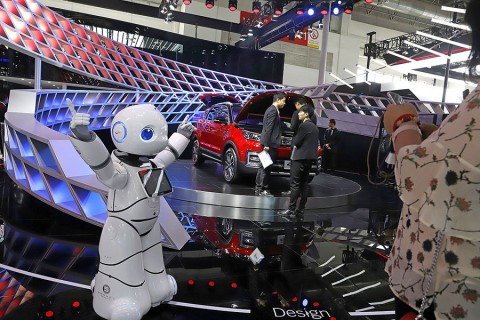 A robot entertains visitors at the booth of a Chinese Automaker during the China Auto 2018 show last month in Beijing. Photo: Ng Han Guan / AP
