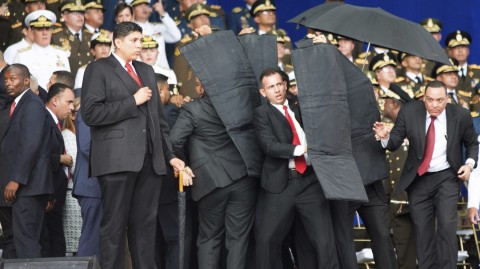 Security personnel surround Venezuela's President Nicolas Maduro after explosives-laden drones exploded near the podium where he was speaking in Caracas on Saturday. Maduro was unhurt. Photo: Xinhua/AP