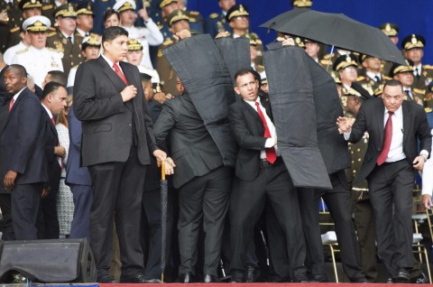 Security personnel surrounded Venezuelan President Nicolas Maduro when an explosive-laden drone disrupted a military parade in Caracas last week. (AP/File)