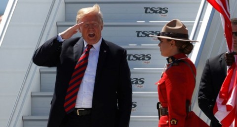 US President Donald Trump salutes as he arrives at Canadian Forces Base Bagotville for the G7 summit. (AFP / Lars Hagberg)
