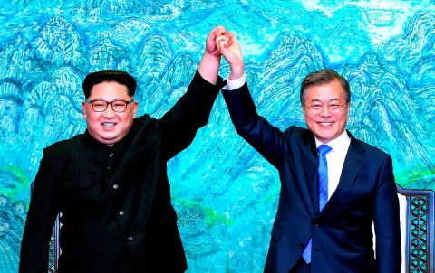 North Korean leader Kim Jong-un and South Korean president Moon Jae-in hold hands after signing a joint statement on April 27, 2018. Photo: Korea Summit Press Pool via AP