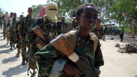 A youth leads a group of hard-line Islamist al-Shabab fighters as they conduct military exercises in northern Mogadishu's Suqaholaha neighborhood, Somalia, Jan. 1, 2010. Photo: AP