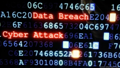 Data on screen, figures and letters, words ‘Data Breach’ and ‘Cyber attack’ in red. Photo: A. March / dpa