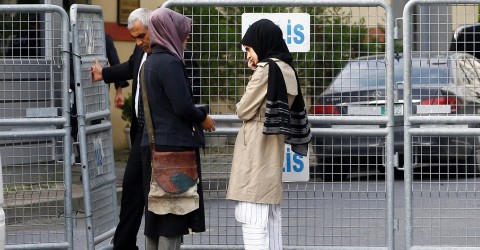 Jamal Khashoggi's fiancée, left, and her friend wait outside the Saudi consulate in Istanbul on Wednesday. Photo: Osman Orsal / Reuters