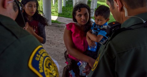Families from Guatemala are detained by Border Patrol agents after crossing the US-Mexico border without authorization along the Rio Grande in Texas in June. Photo: Jahi Chikwendiu/Getty