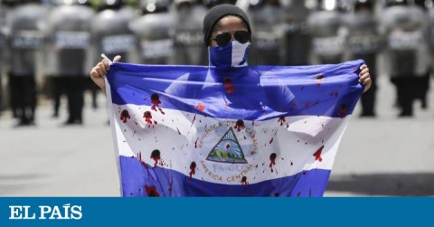 Nicaragua manifestant showing a bloody flag during a protest in September.