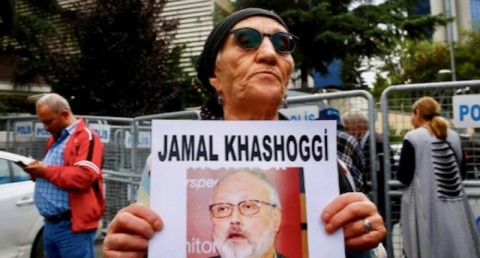A human rights activist holds picture of Saudi journalist Jamal Khashoggi during a protest outside the Saudi Consulate in Istanbul, Turkey October 9, 2018. Photo: Osman Orsal / Reuters