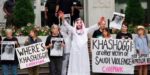 A demonstrator dressed as Saudi Arabian Crown Prince Mohammed bin Salman with blood on his hands protests with others outside the Saudi Embassy in Washington, DC, on October 8, 2018. Photo: Jim Watson / AFP